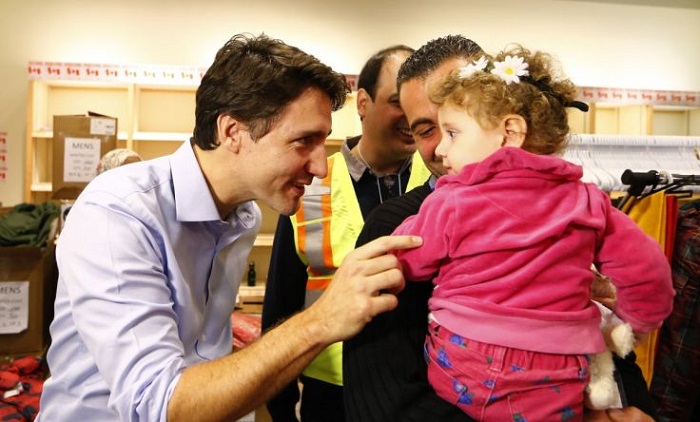 Syrian Refugees Greeted by Justin Trudeau in Canada